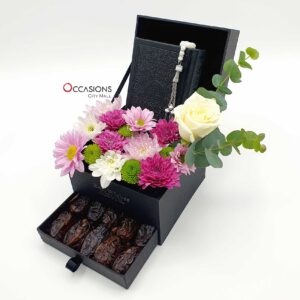 Black Quran with dates drawer and flower arrangement delivery in Amman Jordan